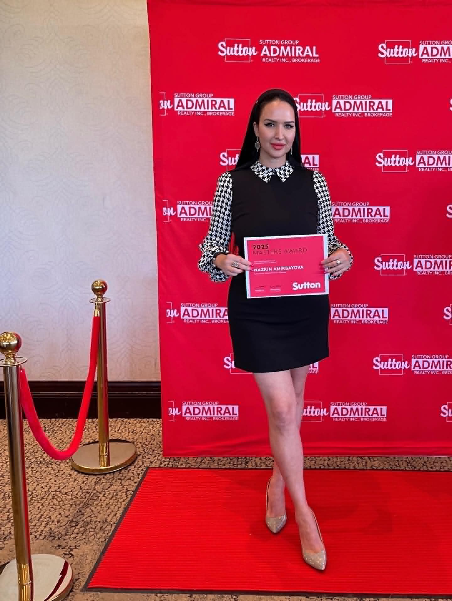 Nazrin Amirbayova holding the 2025 Sutton Masters Award certificate